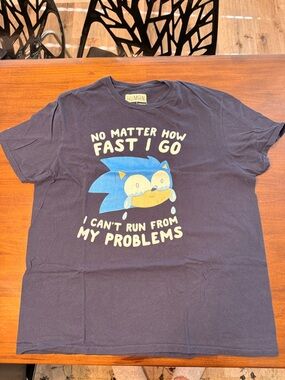 Graphic Tee with Blue Character and White Text
